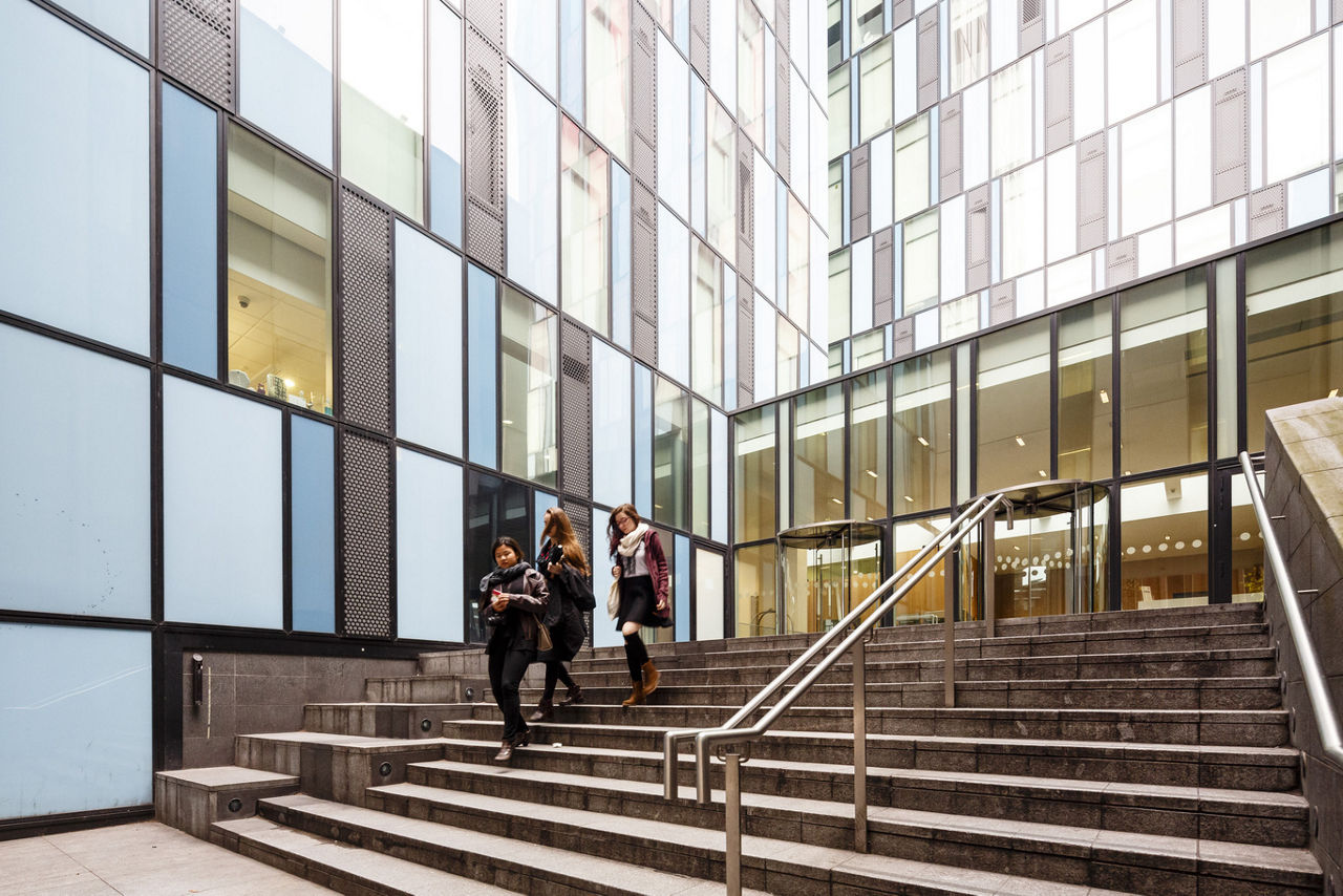 Three people walking down the stairs | Blog | Greystar